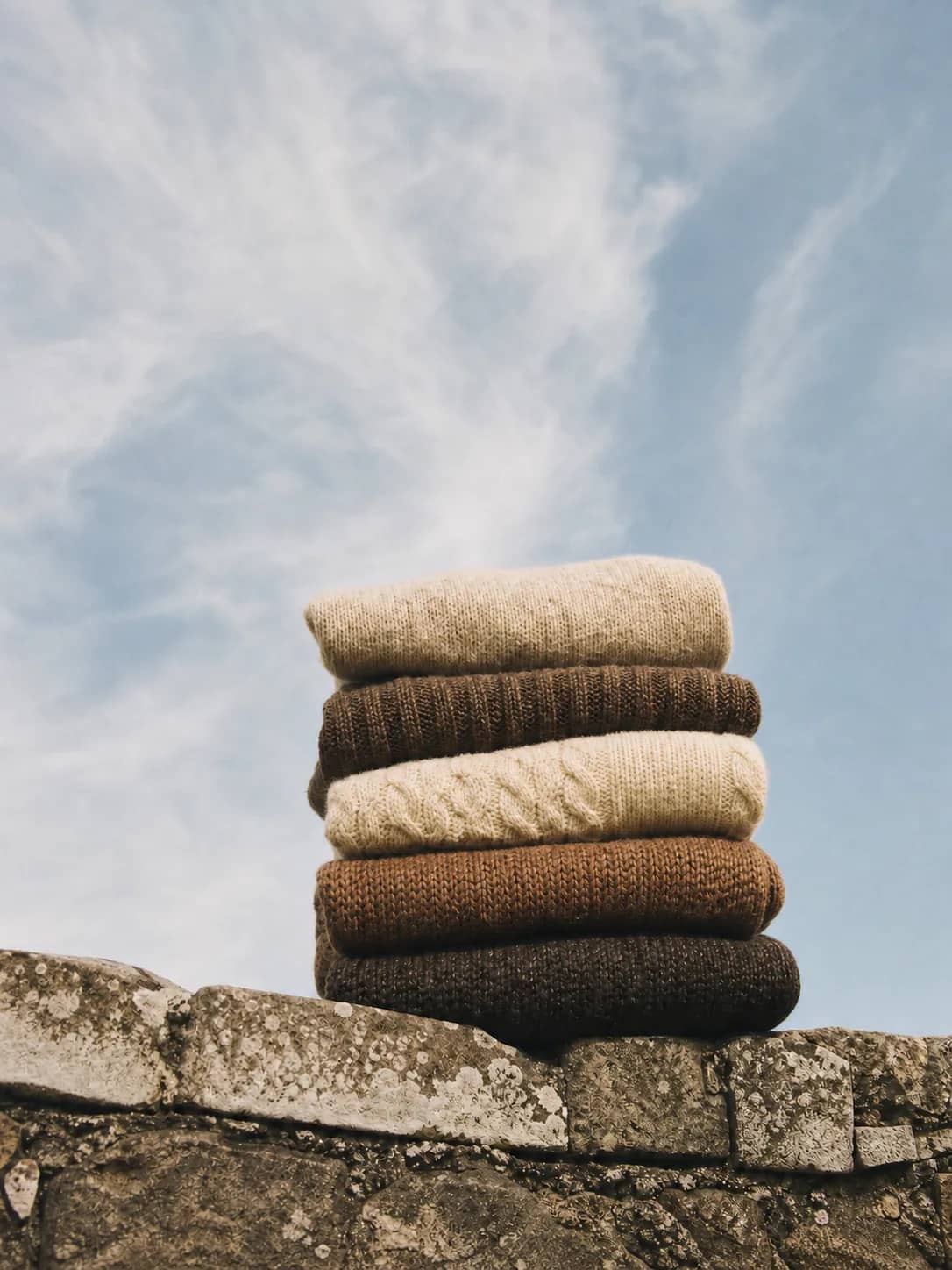 Layered knitwear representing manufacturing choices designed for long-term use