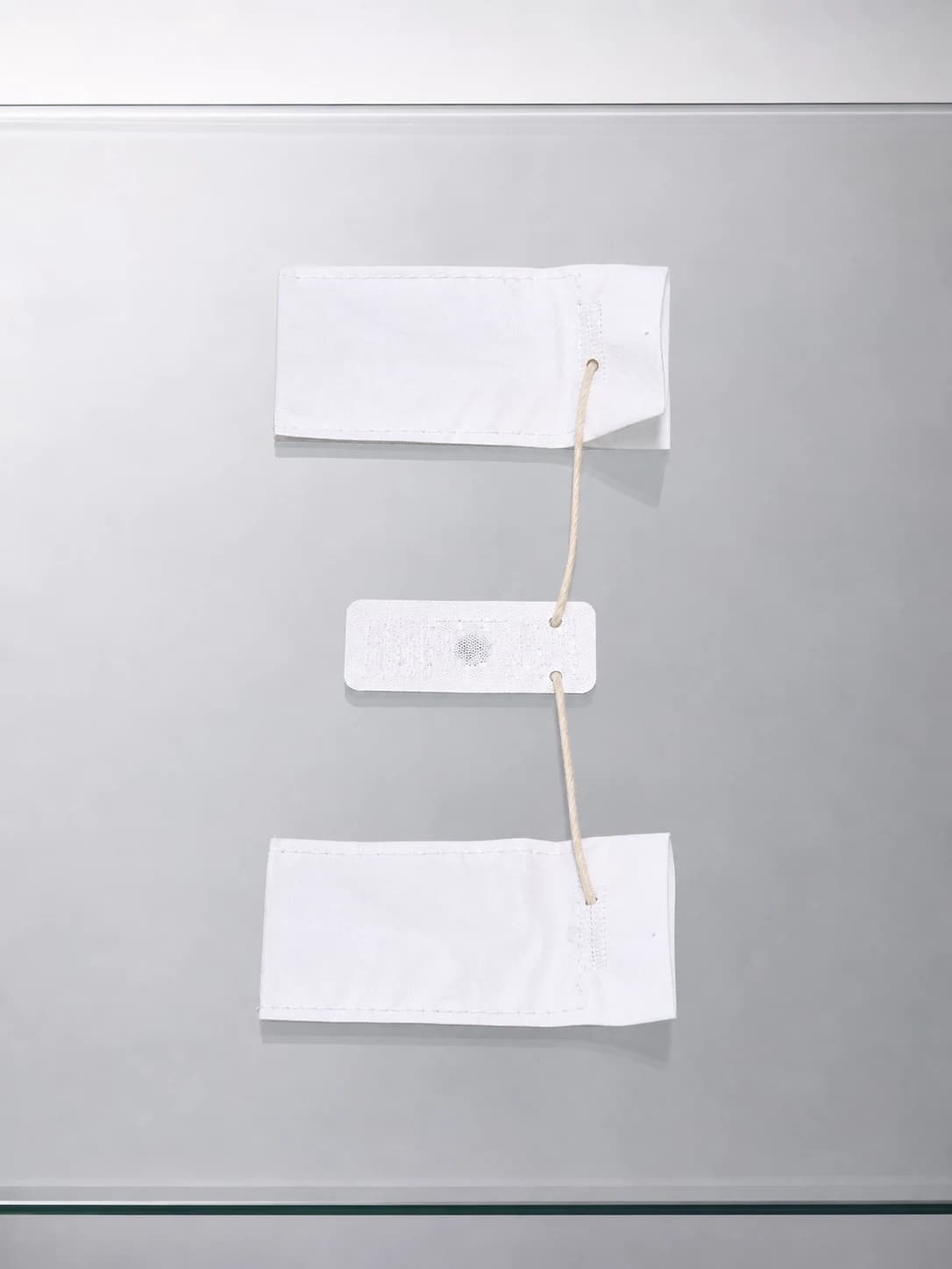 Fabric tags with a reusable RFID chip